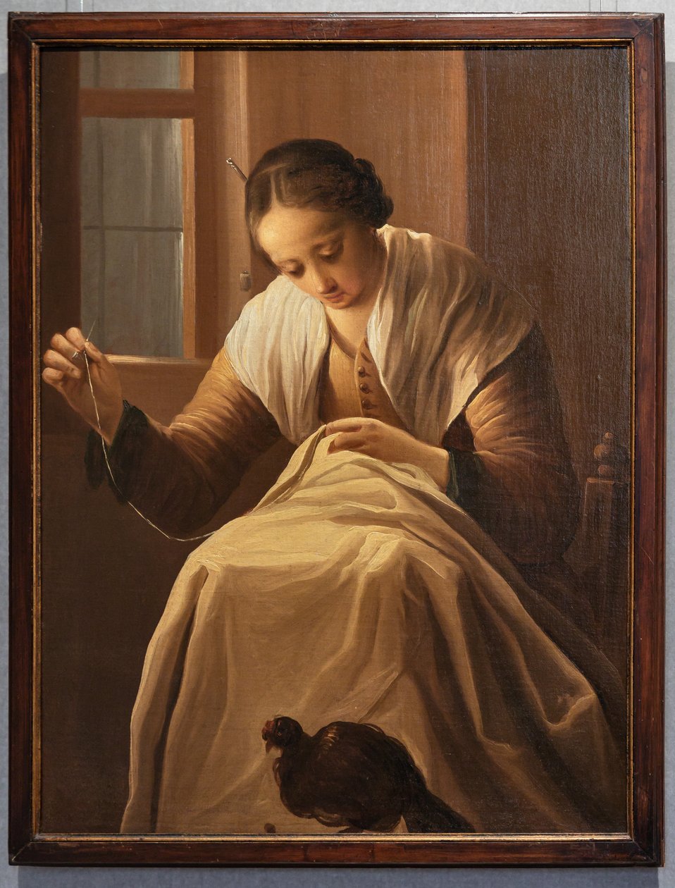 Ragazza che cuce da Antonio Cifrondi