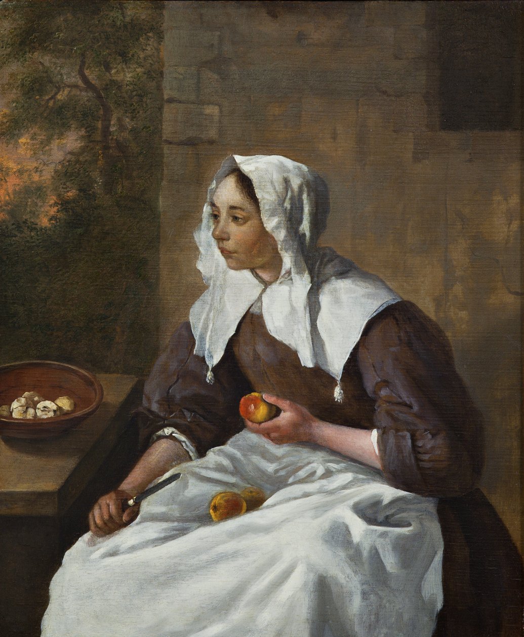 Ragazza che sbuccia mele da Gabriel Metsu