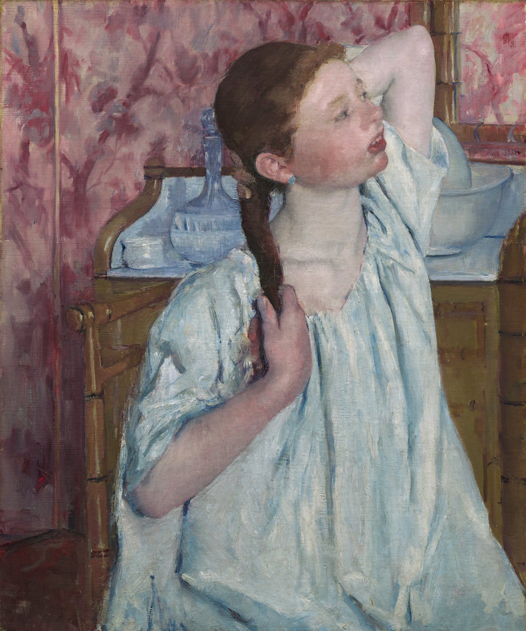 Ragazza che si sistema i capelli da Mary Cassatt