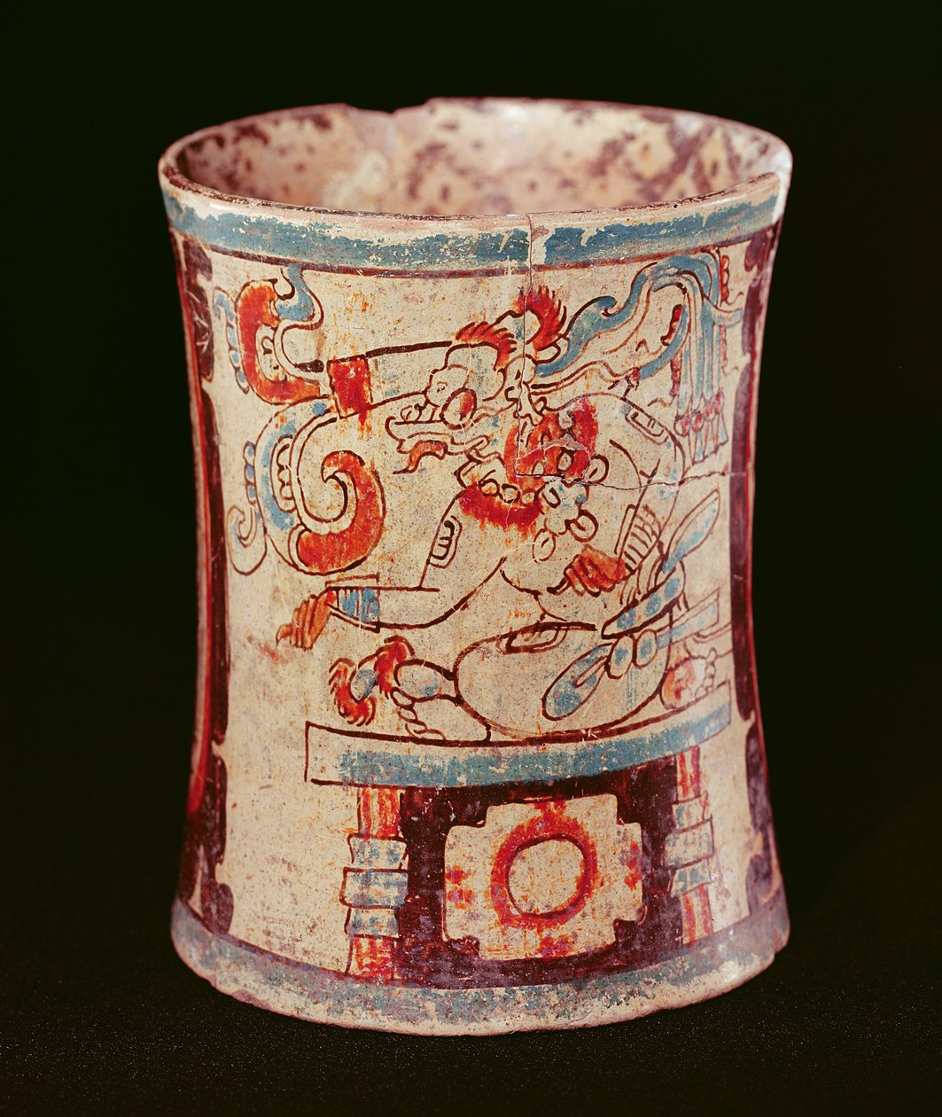 Vaso cilindrico che raffigura una divinità con riccioli di discorso da Mayan
