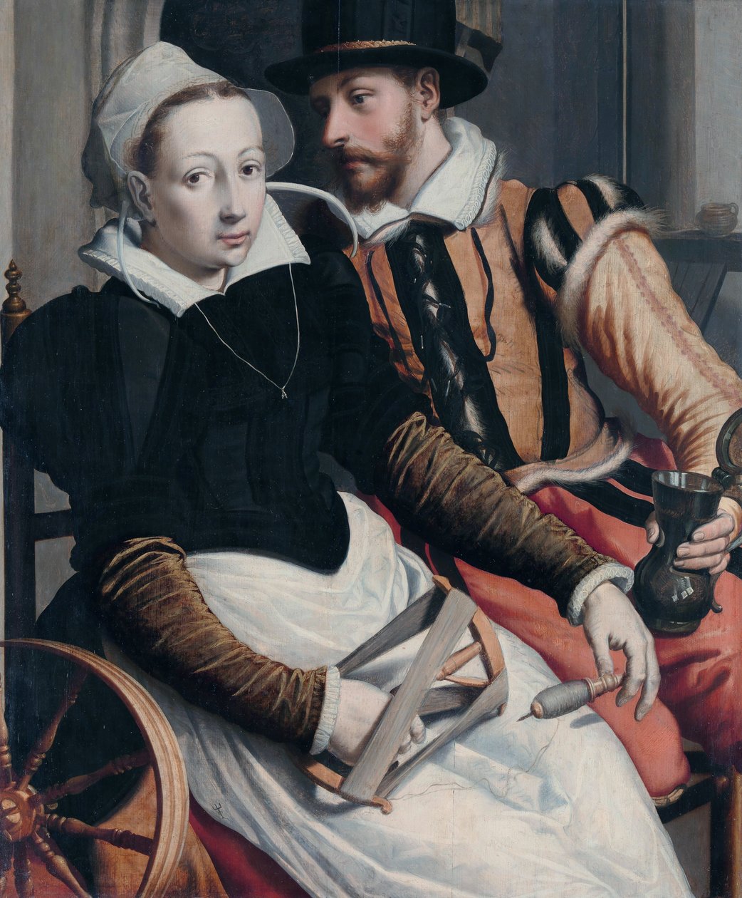 Una Donna alla Ruota da Filare e un Uomo con una Tazza Seduto in un Interno da Pieter Pietersz the Elder