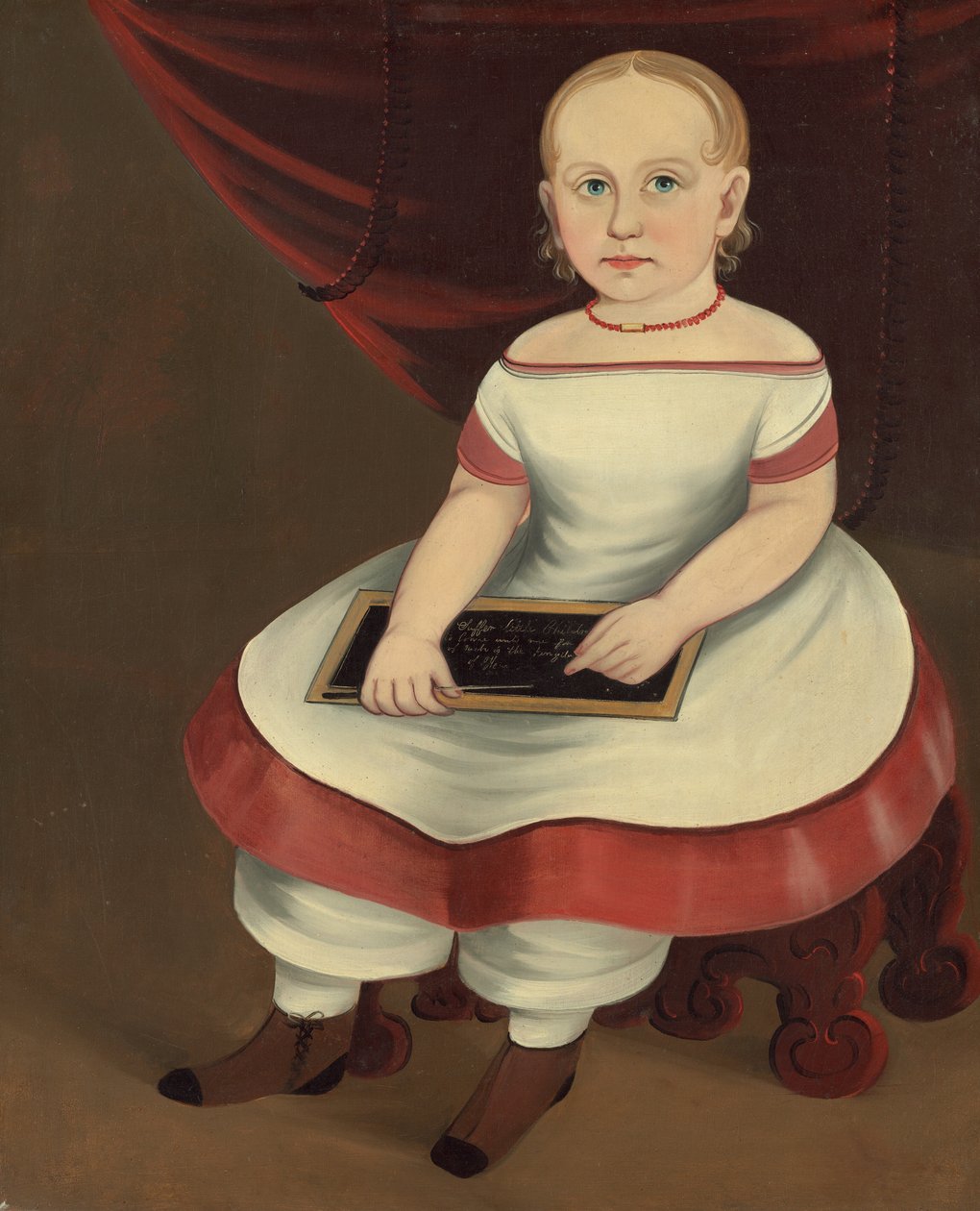 Bambina con lavagna da Prior Hamblin School