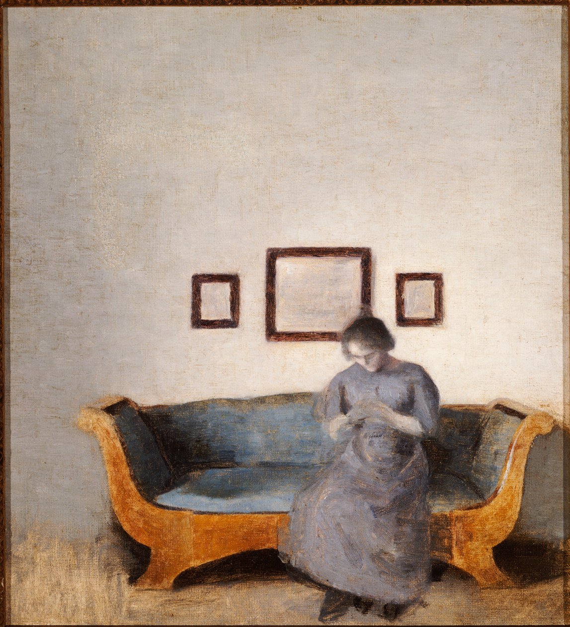 Ida Hammershoi seduta su un divano da Vilhelm Hammershoi
