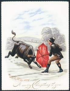 Toro che carica un ombrello rosso